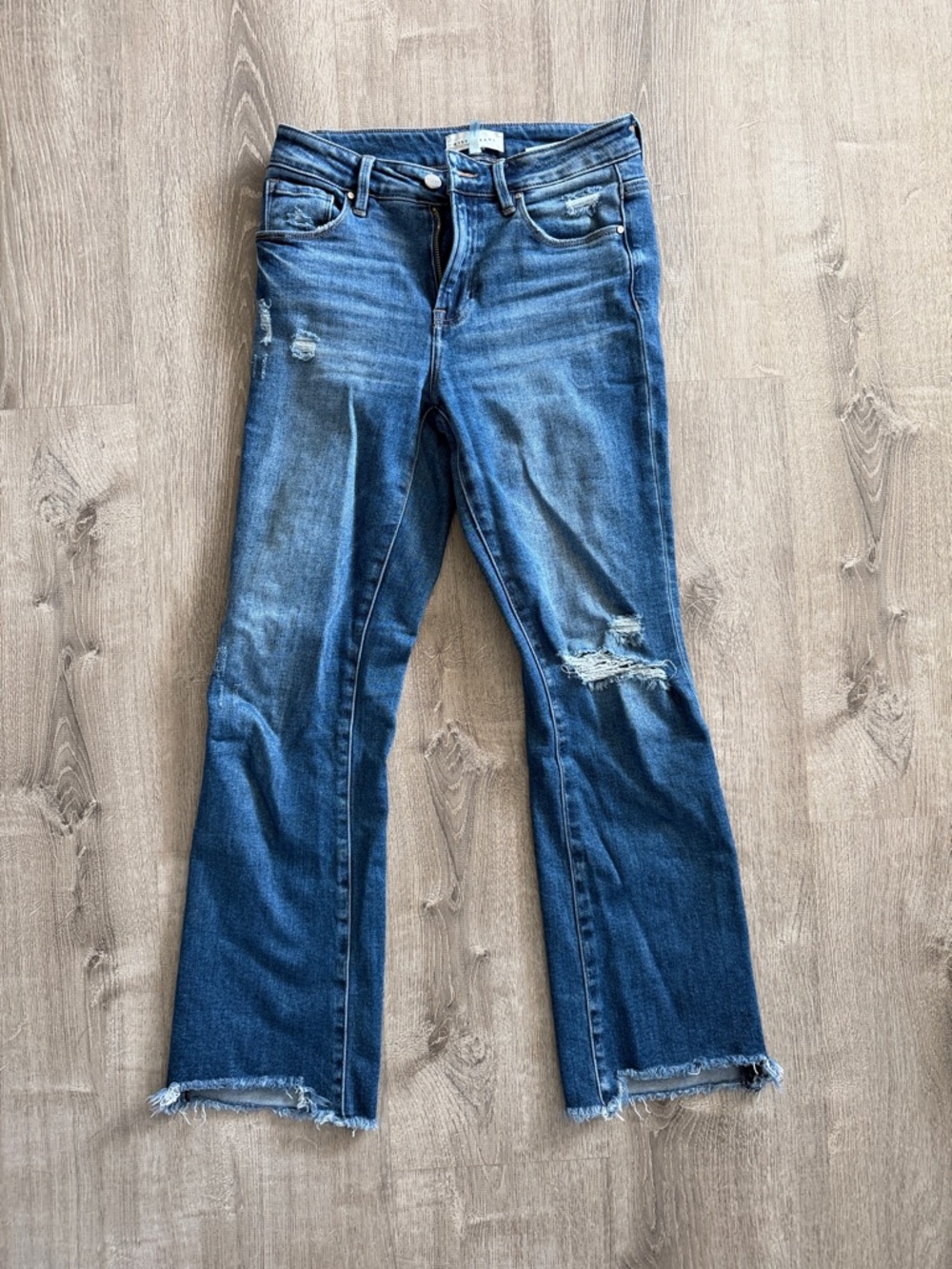 Risen Mid Wash Flare Jeans with Distressed Hem